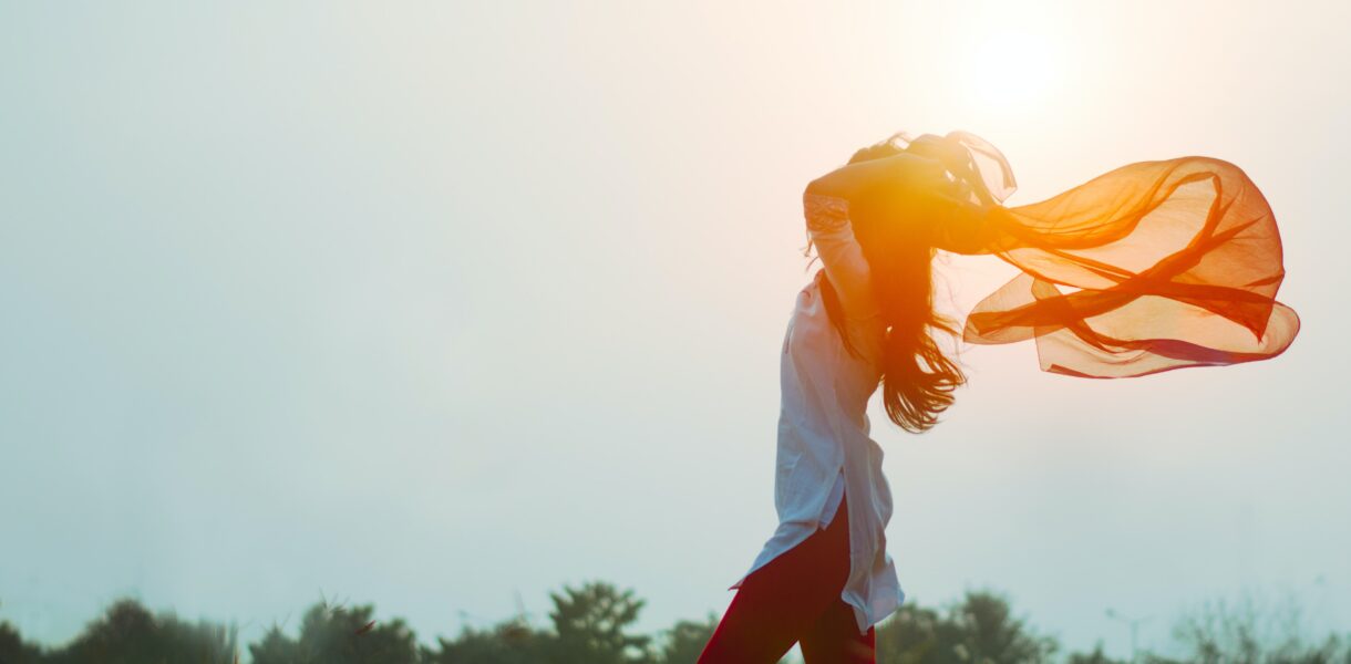 woman spreading hair at during sunset
